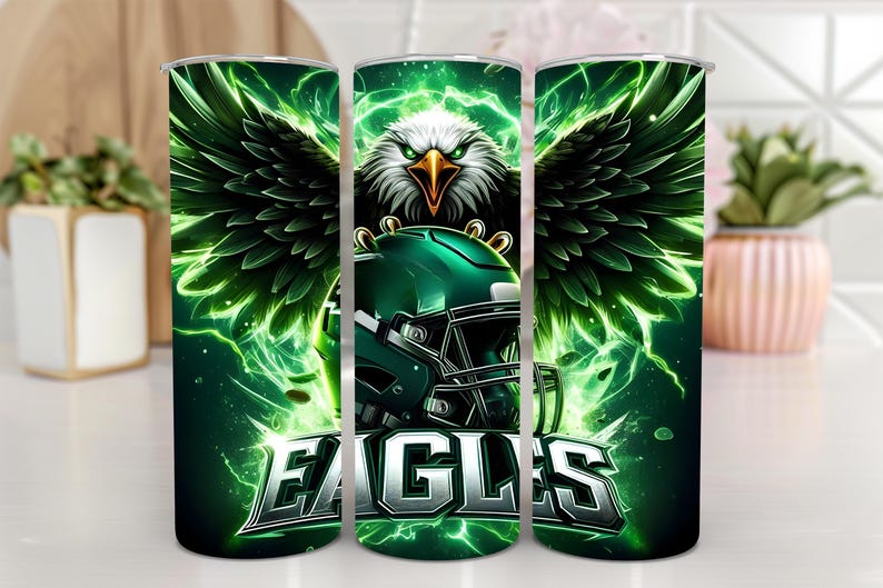 May include: Three green and black stainless steel tumblers with a green and black eagle graphic and the word "EAGLES" in silver lettering.
