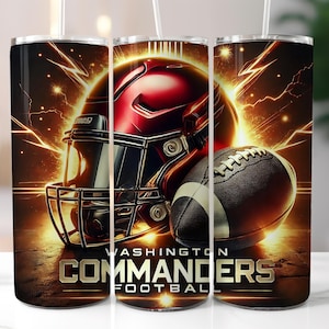 May include: A stainless steel tumbler with a design featuring a red and black football helmet and a football. The design includes the words "Washington Commanders Football".