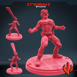 May include: A red figurine of a superhero in a dynamic pose, with arms outstretched and a determined expression. The figure is on a circular base with a grid pattern. The Trident Studio logo is visible in the top right corner.