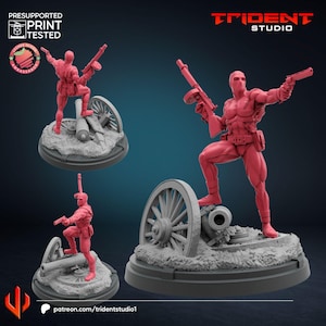 May include: A red action figure of a character in a dynamic pose, holding a gun and standing on a cannon. The figure is on a gray base with a cannon wheel and the Trident Studio logo is visible. The text "PRESUPPORTED PRINT TESTED" is also visible.