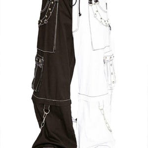 May include: Black and white cargo pants with white stitching and silver hardware. The pants have a split design, with one leg black and the other white.