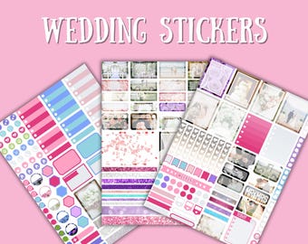 May include: Three sheets of wedding stickers with a pink background. The stickers feature various designs, including stripes, hexagons, and circles in shades of pink, blue, and purple. Some stickers have wedding-themed images and text.