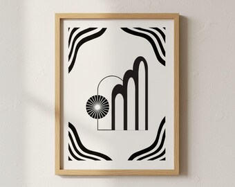 May include: A framed art print featuring a black and white abstract design. The artwork includes geometric shapes, such as arches, a sunburst, and curved lines, set against a white background. The frame is made of light-colored wood.