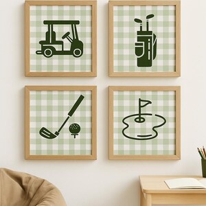 May include: Four framed prints with golf-themed illustrations. Each print features a green and white checkered background and a black silhouette of a golf cart, golf bag, golf club with ball, and a golf hole.