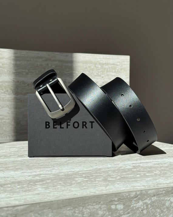 A full Italian leather belt hand-cut and custom-stamped/engraved to order — the kind of heirloom accessory that feels like it came from a boutique artisan shop, not a mall.
