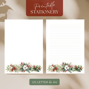 May include: White stationery sheets with a watercolor floral border featuring red berries, white flowers, and green foliage. The top of the image has the text "Printable STATIONERY" in a script font. The bottom of the image has the text "US LETTER & A4".