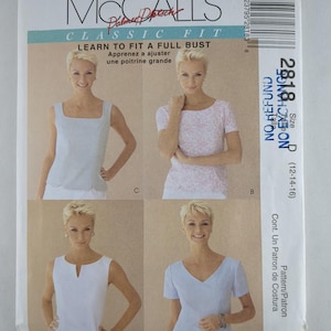 May include: McCall's Classic Fit sewing pattern for a full bust. The pattern includes instructions to learn how to fit a full bust. The pattern features four different tops with varying necklines and sleeve lengths. The size is 12-14-16.