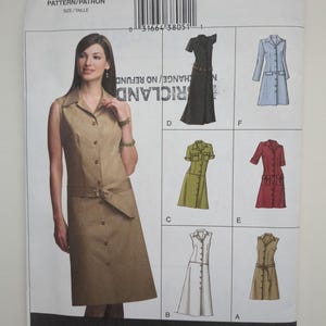 May include: A Vogue Easy sewing pattern envelope V7873 for a button-front dress with a collar and belt. The front shows a tan sleeveless dress, while the back displays illustrations of variations D, F, C, E, B, and A in different colours and sleeve lengths.