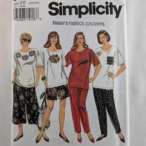 May include: Simplicity sewing pattern number 8448, size FF (18W-24W), for a top and trousers. The pattern shows four different models wearing the clothing. The top is a loose-fitting, short-sleeved t-shirt. The trousers are a wide-leg style. The models are wearing different colours and patterns of the clothing.