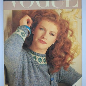 May include: Vogue magazine cover showing a woman with red hair in a blue Fair Isle knit cardigan. The cover text reads "Fair Isle & Textured Knits" and "Christina Probert". The Vogue Knitting Library logo is in the lower right corner.