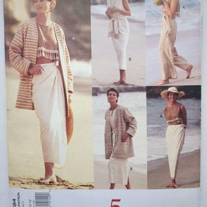 May include: A Vogue 5 Easy Pieces sewing pattern envelope 1384 featuring illustrations of clothing including a striped jacket, a cropped top with fringe trim, a wrap skirt, and trousers. The pattern is for sizes 8-10-12 and shows beach-themed imagery.