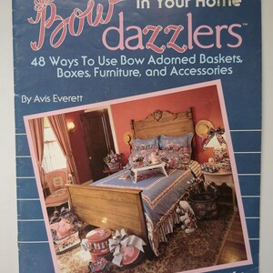 May include: A book cover for "Bow Dazzlers" showing a bedroom scene with a bed and bow-adorned accessories. The book, by Avis Everett, details 48 ways to use bows on baskets, boxes, furniture, and accessories. Features Stiffy.