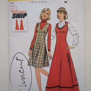 May include: A Style 4840 sewing pattern envelope for a Miss size 14, bust 36 dress. The cover features illustrations of two dresses: a knee-length plaid jumper over a red turtleneck and a floor-length red dress over a white collared shirt.