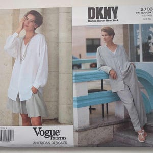 May include: A DKNY Vogue sewing pattern envelope 2703 for sizes 6-8-10. The front shows two images: one of a person in a white long-sleeved shirt and light gray skirt, and another of a person in a light gray button-down jacket and matching trousers.