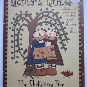 May include: A book cover titled "Meme's Quilts" with a tree and two figures embracing. The cover includes the text "a collection of Primitive & country Quilts, Stitchery, and Pillows" and "The Sheltering Tree."