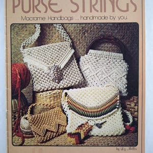 May include: A book cover titled "PURSE STRINGS" featuring macrame handbags. The image shows several handmade macrame purses in various styles and colours, including beige and brown. The text on the cover reads "Macrame Handbags... handmade by you."