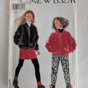 May include: New Look sewing pattern number 6952 for sizes 9-14. The pattern includes instructions for making two jackets, one black and one red, with a zip closure. The model on the left is wearing a black jacket with a red skirt and black leggings. The model on the right is wearing a red jacket with black and white patterned trousers.