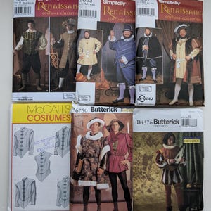 May include: A collection of six sewing pattern envelopes for historical costumes, including Simplicity Renaissance patterns 4059, 9633, and 9650, a McCall's costume pattern, and Butterick patterns 6750 and B4376, featuring illustrations of various period garments.