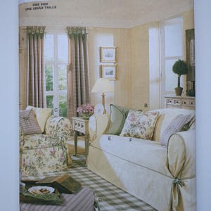 May include: A Butterick Waverly sewing pattern showing a room interior with a sofa, armchair, and curtains. The pattern includes the text "ONE SIZE" and "UNE SEULE TAILLE". The room has a checkered floor and floral patterned cushions.
