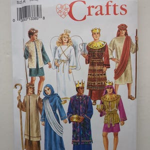 May include: A Simplicity Crafts sewing pattern envelope 8152, size A (XS-XL), featuring illustrations of eight historical or biblical costumes. The designs include tunics, robes, crowns, an angel with wings, and various accessories like staffs and bowls.