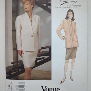May include: A Vogue Designer Original sewing pattern envelope for a Genny suit, featuring a photograph and illustration of a long-sleeved, single-button blazer and a knee-length skirt. The pattern number 1392 is printed on the front for sizes 8-12.