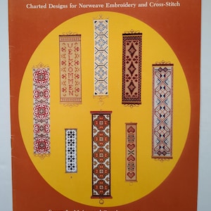 May include: The cover of a book titled "BELLPULLS" showing charted designs for Norweave Embroidery and Cross-Stitch. It displays several vertical cross-stitch patterns in different colours and designs, set against a yellow circle on an orange background.