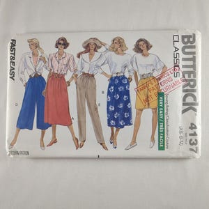 May include: A Butterick Classics 4137 sewing pattern featuring illustrations of women's clothing designs. The pattern includes designs for tops, skirts, and pants. The cover has the text "FAST & EASY" and "VERY EASY / TRÈS FACILE".