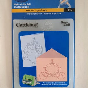 May include: A Disney-themed embossing folder set featuring Cinderella. The package includes two folders with designs of Cinderella and a carriage. The text on the package reads "Night at the Ball" and "Cuttlebug".