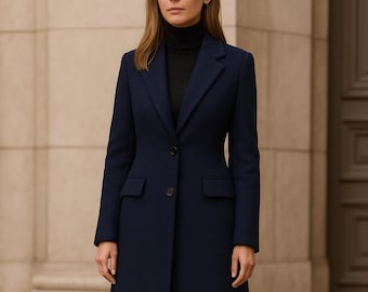 May include: A navy blue coat with a classic design. The coat features a notched lapel, a single-button closure, and two front pockets. The coat is worn over a black turtleneck and paired with black boots.