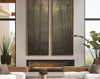 May include: Two framed vertical art prints depicting a misty forest scene. The artwork features tall, slender trees in a muted color palette of greens and browns. The frames are a warm, natural wood tone, complementing the artwork's earthy tones. The prints hang above a fireplace.