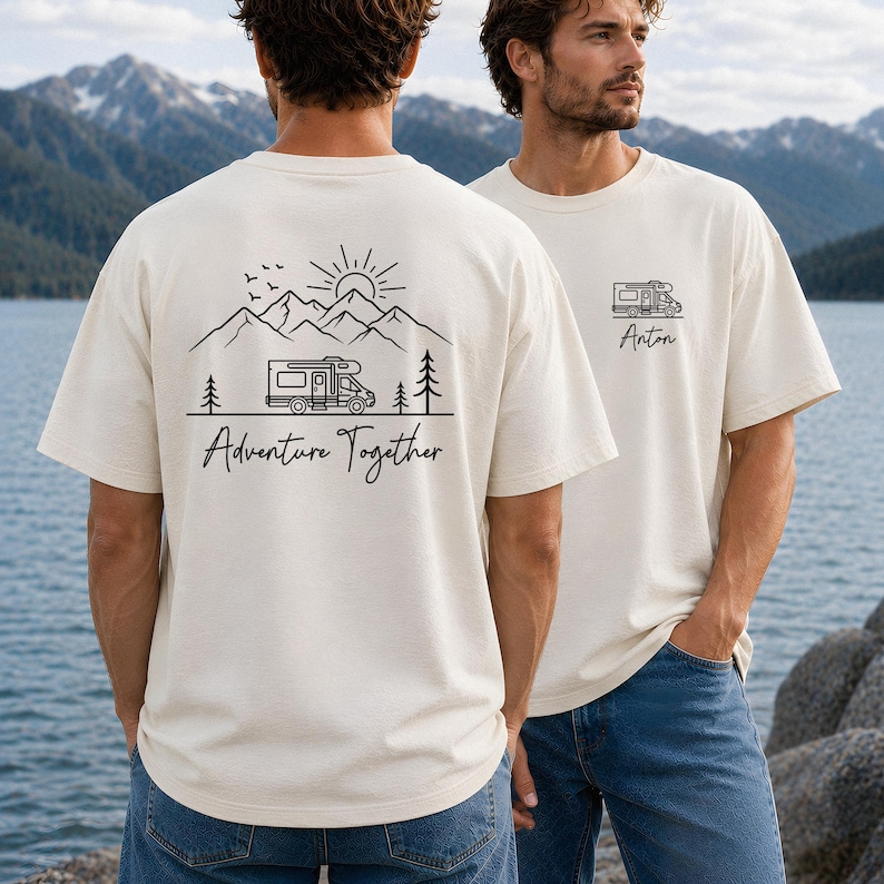 May include: Cream-colored t-shirts with a black graphic of a camper van, mountains, trees, and the text "Adventure Together" on the back. One shirt has the name "Anton" printed on the front. The shirts are short-sleeved and appear to be made of a soft material.