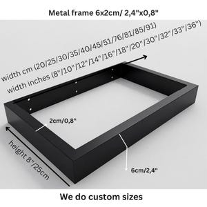 May include: A rectangular black metal frame with a 6x2cm (2.4x0.8 inch) profile. The frame has a height of 8 inches (25 cm) and a width ranging from 20 to 91 cm (8 to 36 inches). The frame features pre-drilled holes along the inner side walls.