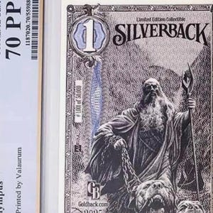May include: A 2025 1 Silverback Olympus collectible banknote encased in a protective slab. The note features a black and white illustration of a bearded figure holding a staff with a three-headed dog, labeled 1/1000th troy ounce pure silver.