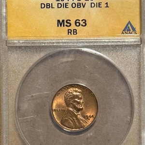 May include: A 1944-D 1C Lincoln penny, graded MS 63 RB, encased in a protective holder. The coin features a profile of Abraham Lincoln and the year 1944. The holder displays the coin's grade and the ANACS certification.