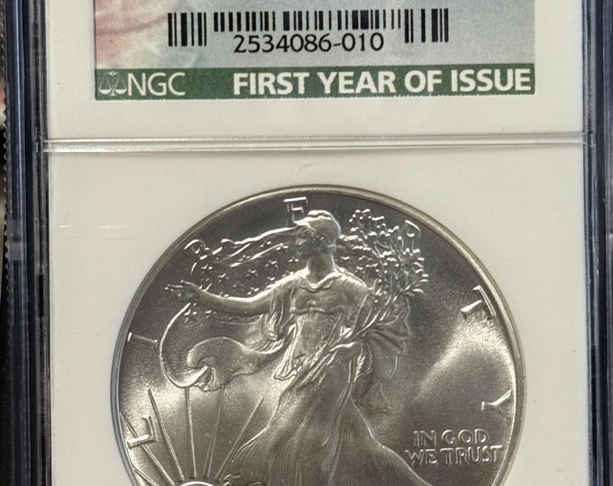 1986 P American Silver Eagle ASE • Key Date • Philadelphia Mint • First Year of Issue Label • 1 oz 99.9% Pure Silver • Graded NGC MS69