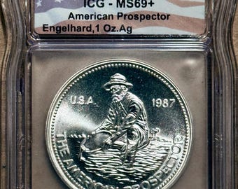 1987 Engelhard American Prospector, Eagle Reverse • 1 oz Pure Silver Round (.999 Fine) • Flag Label, Graded ICG MS69+