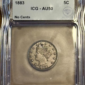 May include: An 1883 Liberty Head nickel encased in a clear plastic holder. The coin features a profile of Lady Liberty and the date 1883. The holder has a label with "ICG - AU50" and "No Cents" printed on it.