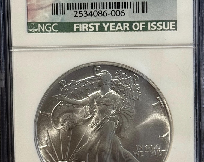 1986 P American Silver Eagle ASE • Key Date • Philadelphia Mint • First Year of Issue Label • 1 oz 99.9% Pure Silver • Graded NGC MS69