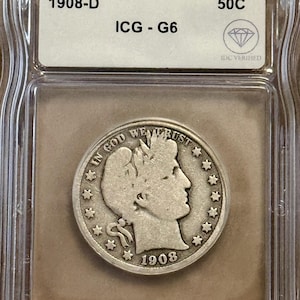 May include: A 1908-D 50C silver coin, graded ICG-G6, encased in a protective holder. The coin features a profile of a woman and the inscription "IN GOD WE TRUST". The year 1908 is visible.