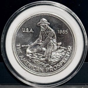 1985 Engelhard American Prospector Vintage Silver Round • 1 oz Fine Silver (99.9% Pure) • Brilliant Uncirculated in Protective Capsule