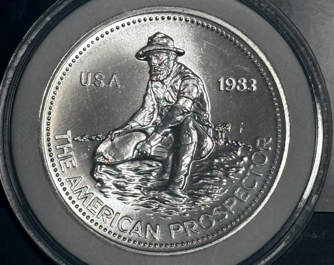 1983 Engelhard American Prospector • KEY DATE • Vintage Silver Round Uncirculated in Capsule • 1 oz Fine Silver (99.9% Pure) • Big E Reverse
