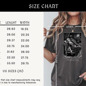 May include: Dark gray t-shirt with a black and white graphic of a woman on a chaise lounge, with the text "I am after so weary." The shirt has a size chart with measurements in inches.
