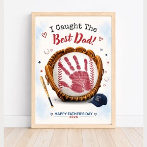 May include: A framed print featuring a brown baseball glove holding a white baseball with a red handprint. The text reads I Caught The Best Dad! and Happy Father's Day 2026. A small baseball bat labelled My Hero and a navy blue cap saying Best Dad Ever are included.