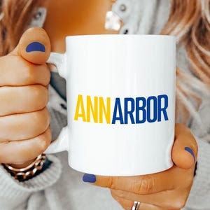 Ann Arbor Coffee Mug Blue Yellow Ceramic Cup Michigan College Town Gift for Wolverines Fans Students Alumni Game Day Tailgate School Pride