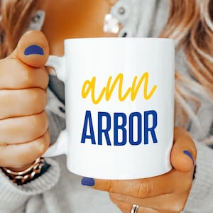 Ann Arbor Coffee Mug Blue Yellow Script Font Ceramic Cup Michigan College Town Gift for Wolverines Fans Students Alumni Game Day Pride