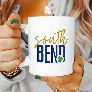 South Bend Coffee Mug Irish Shamrock Notre Dame Inspired Gold Blue Script College Town Gift for Football Fans and Alumni
