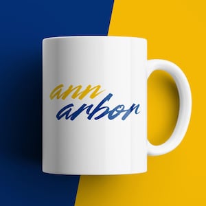 Ann Arbor coffee mug blue and yellow ceramic gift for Michigan fans college town souvenir retro script style minimalist city mug