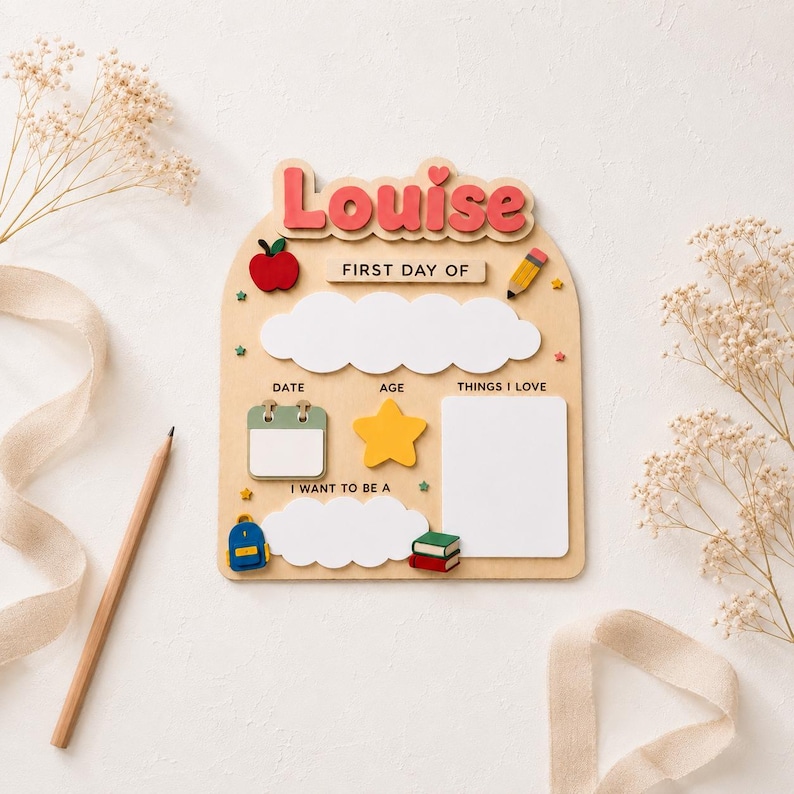May include: A wooden arch-shaped sign with the name Louise in pink letters at the top. It features the text First Day Of, Date, Age, Things I Love, and I Want To Be A, with icons of an apple, pencil, calendar, star, backpack, and books.