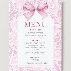 May include: A pink menu card featuring a floral pattern and a bow illustration. The menu displays the word "MENU" and lists courses: Starter, Main, and Dessert. Dishes include Buffalo Caprese, Salmone Alla Griglia, Tagliata, and Tiramisu.