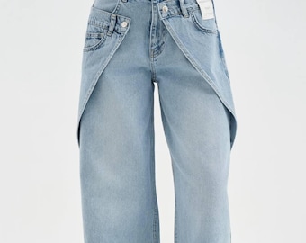 Pantalones vaqueros de pierna ancha de estilo vanguardista: pantalones vaqueros de mezclilla deconstruidos, cintura superpuesta, lavado claro.